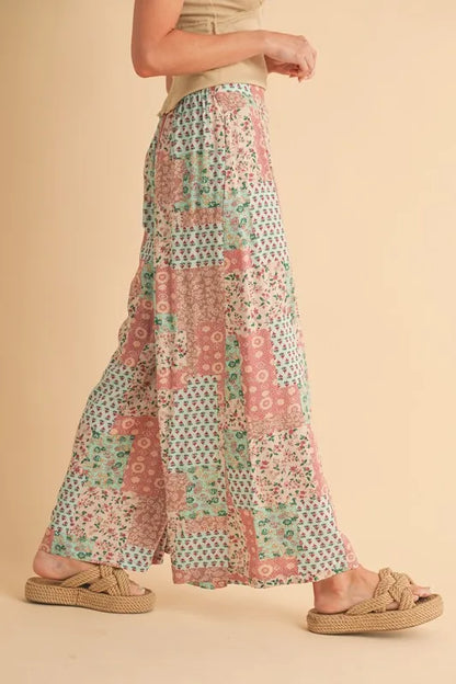 Mint pink Aemi+Co printed wide-leg pants by Trendsi, featuring a relaxed fit and stylish floral pattern.