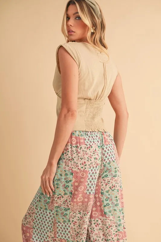 Mint pink Aemi+Co printed wide-leg pants from Trendsi, featuring a flowy fit and stylish pattern, perfect for casual wear.
