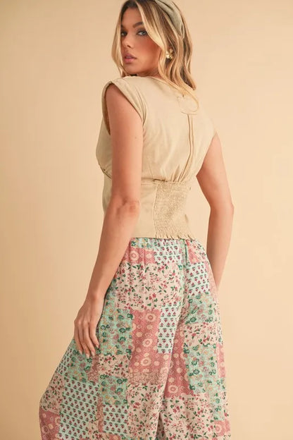 Mint pink Aemi+Co printed wide-leg pants from Trendsi, featuring a flowy fit and stylish pattern, perfect for casual wear.
