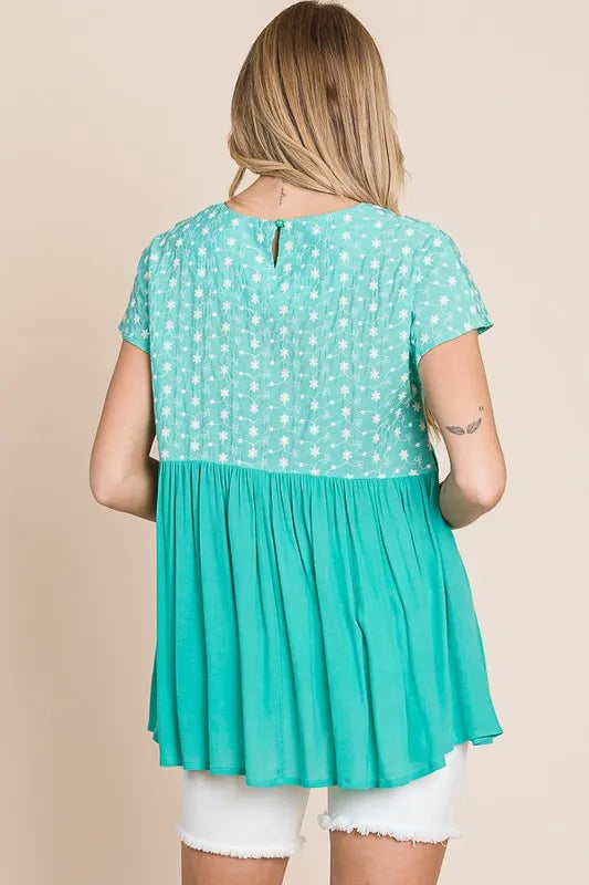 Plus size Lime 'N' Chili embroidered short sleeve pleated babydoll top by Trendsi, featuring a vibrant green color and stylish design.