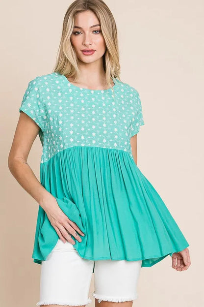 Plus size Lime 'N' Chili embroidered short sleeve pleated babydoll top by Trendsi, featuring vibrant lime green color and delicate embroidery.