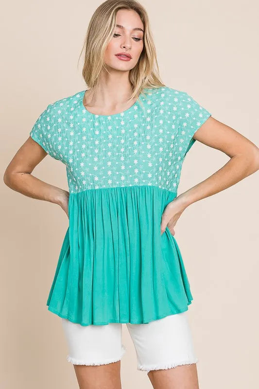 Plus size Lime 'N' Chili embroidered short sleeve pleated babydoll top by Trendsi, shown in mint green, with detailed embroidery.