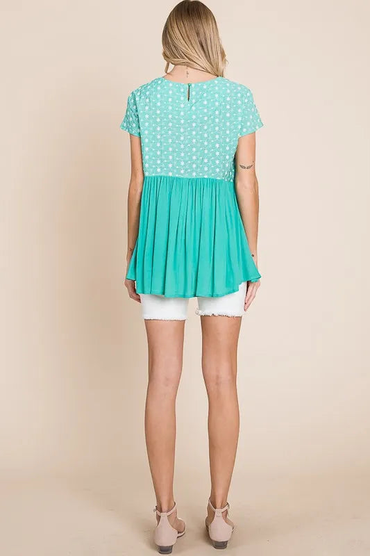Plus size Lime 'N' Chili embroidered short sleeve pleated babydoll top by Trendsi, featuring vibrant lime color and detailed embroidery.