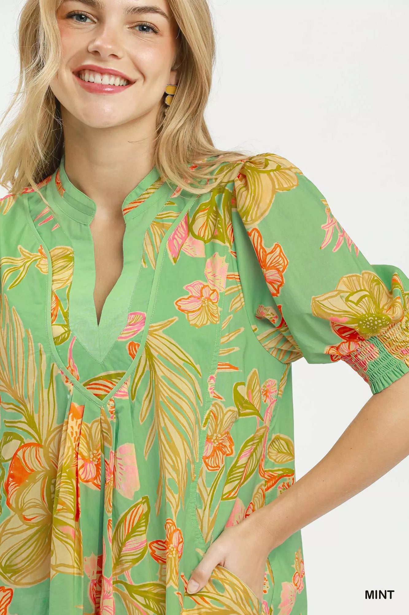 Mint Umgee botanical print dress with smocked cuffs, featuring a flowy silhouette and vibrant floral pattern.