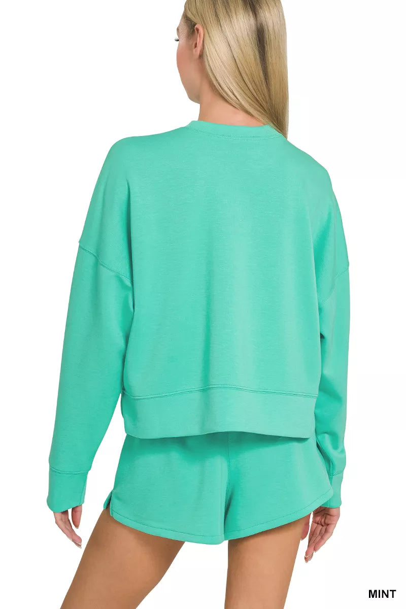 Mint green Zenana scuba long sleeve sweatshirt and shorts set by Trendsi, casual loungewear with a relaxed fit.