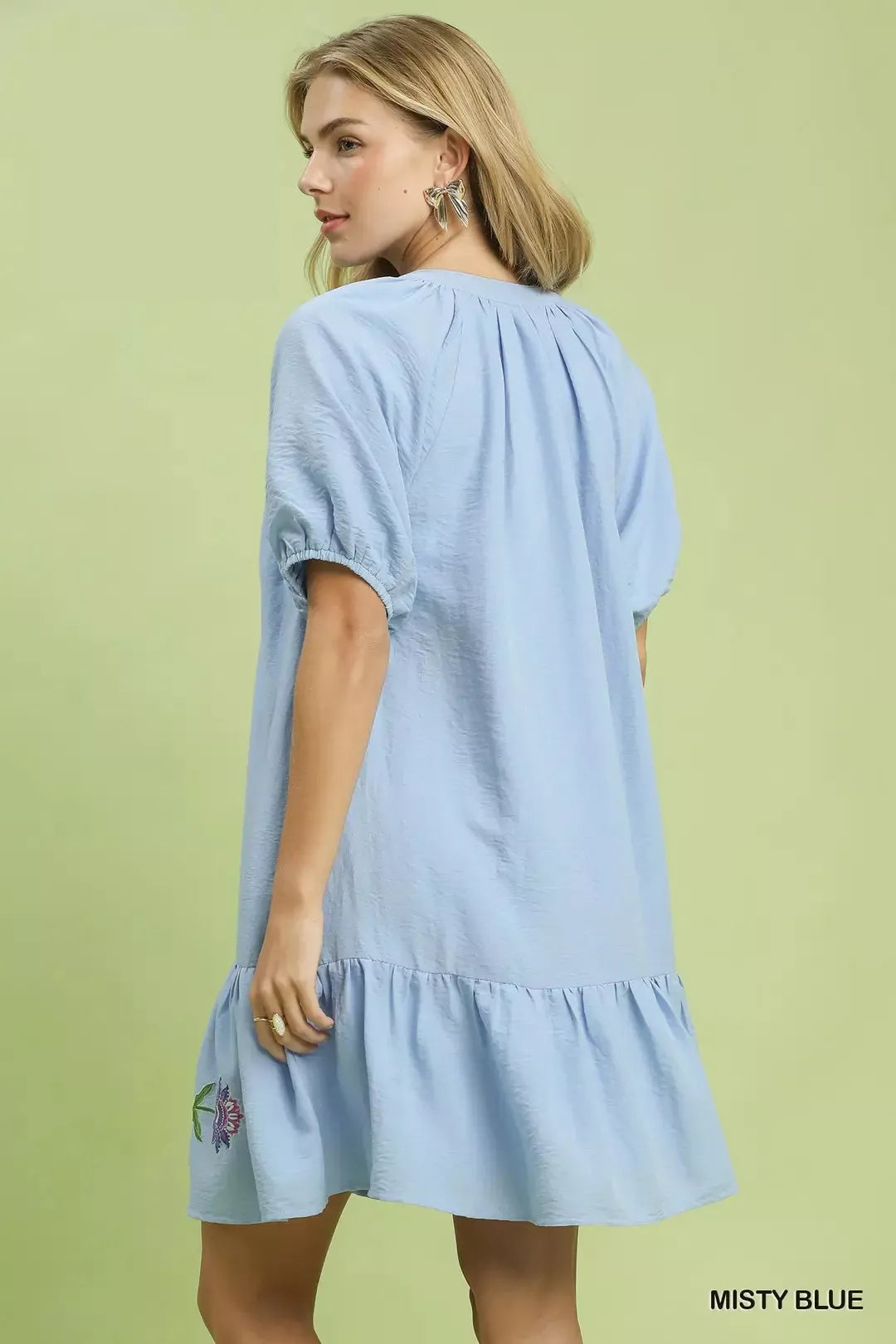 Umgee embroidered floral babydoll dress in misty blue with delicate embroidery and a feminine, flowy silhouette.