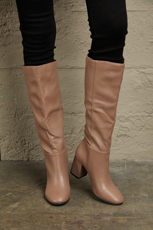 Mocha East Lion Corp block heel knee-high boots with stylish design, featuring a sleek silhouette and comfortable fit.