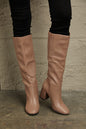 Mocha East Lion Corp block heel knee-high boots with stylish design, featuring a sleek silhouette and comfortable fit.