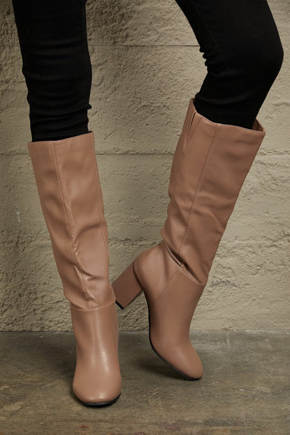 Mocha knee-high boots with block heels from East Lion Corp, featuring a stylish design and sturdy footwear construction.