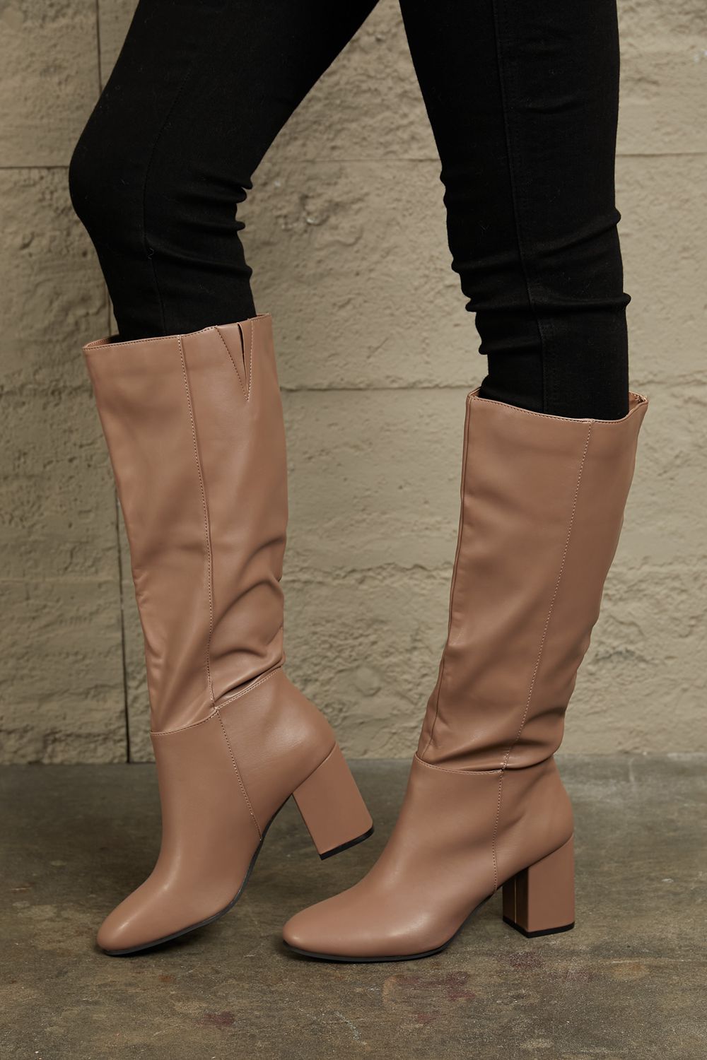 Mocha knee-high boots by East Lion Corp with block heels, stylish and comfortable for fashionable winter wear.