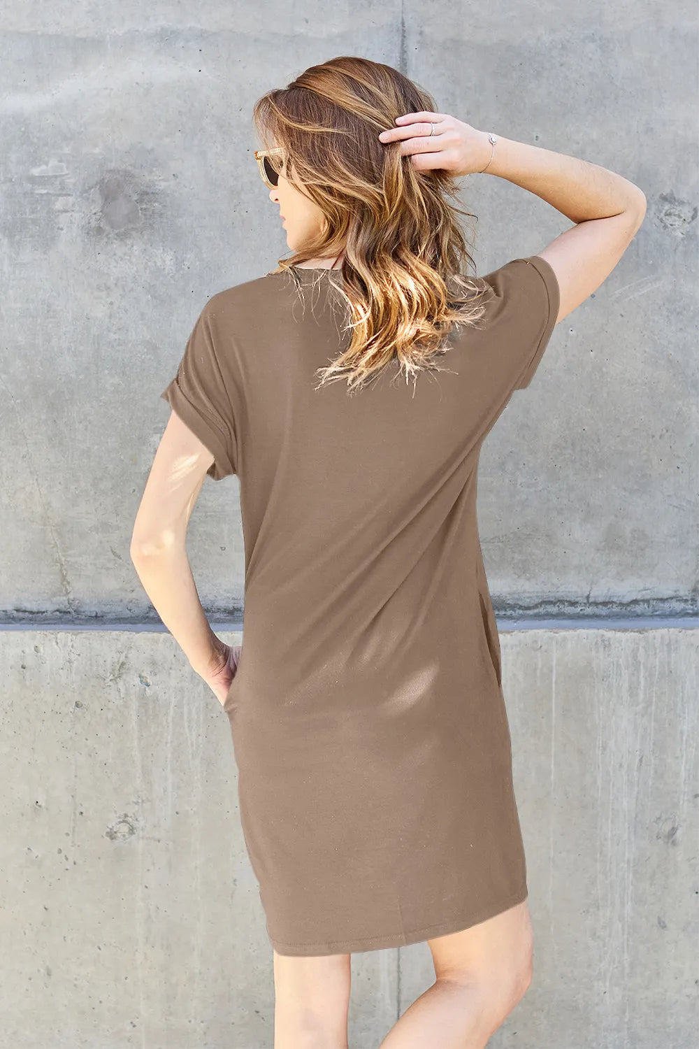 Mocha Basic Bae full-size round neck short sleeve dress with pockets by Trendsi, showing a casual, comfortable fit and stylish design.