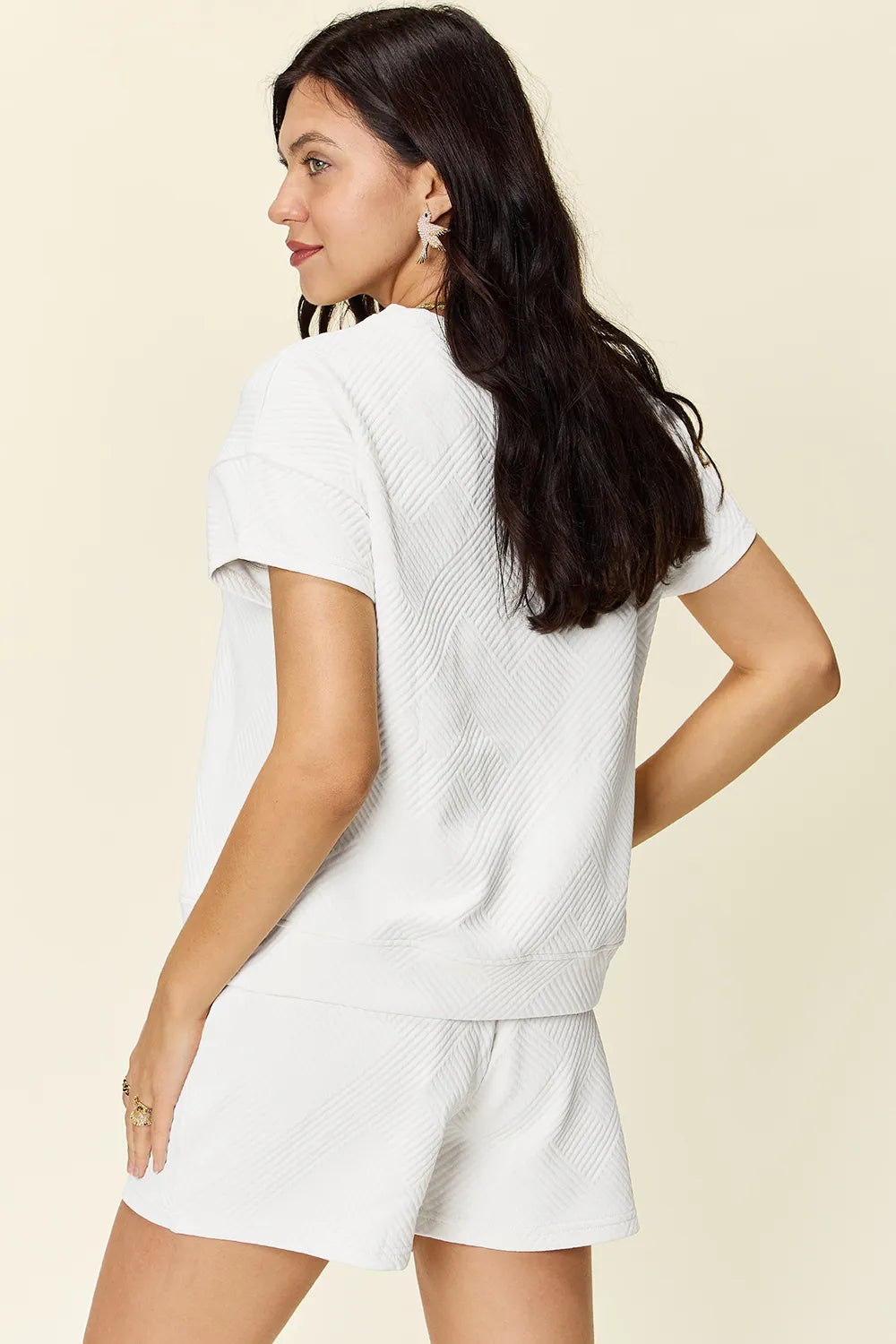 Trendsi mocha-colored double take full size texture short sleeve T-shirt and drawstring shorts set on mannequin.
