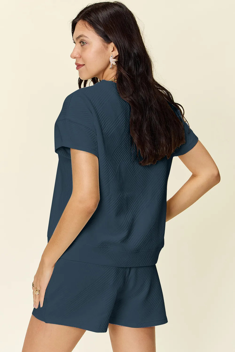 Trendsi mocha double take full size textured short sleeve t-shirt and drawstring shorts set on a model