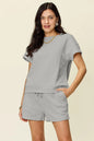 Trendsi mocha double take full-size textured short sleeve T-shirt and drawstring shorts set on a model.