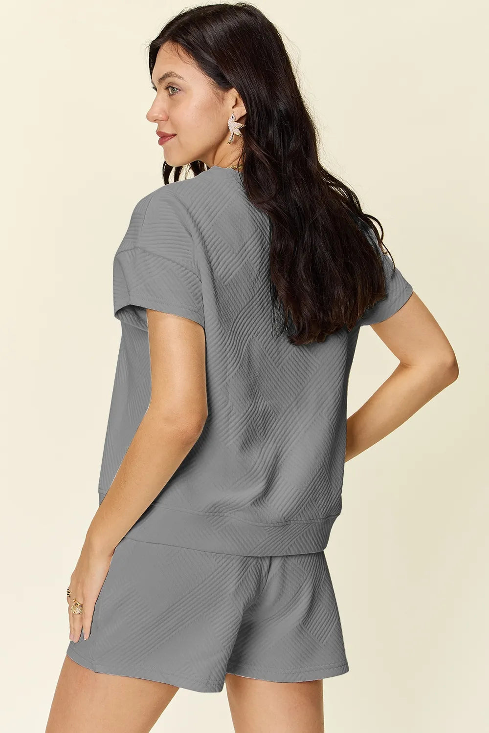 Trendsi mocha double take full-size textured short sleeve t-shirt and drawstring shorts set laid flat.