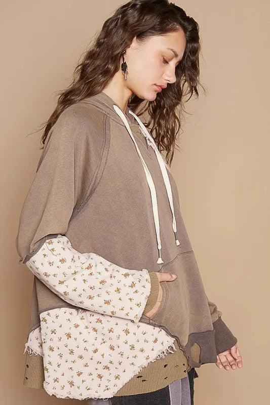 Mocha floral patchwork distressed drawstring hoodie from Trendsi, casual style with floral and patchwork details.