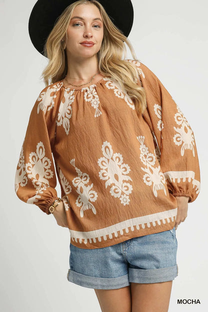 Plus size Umgee two-tone border print top with balloon sleeves, featuring a stylish casual design and trendy pattern.