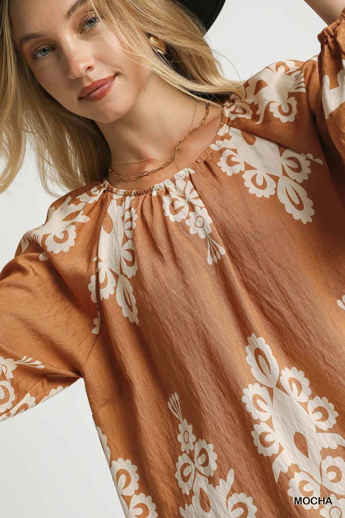 Plus size Umgee two-tone border print top with balloon sleeves, featuring a stylish design and comfortable fit.