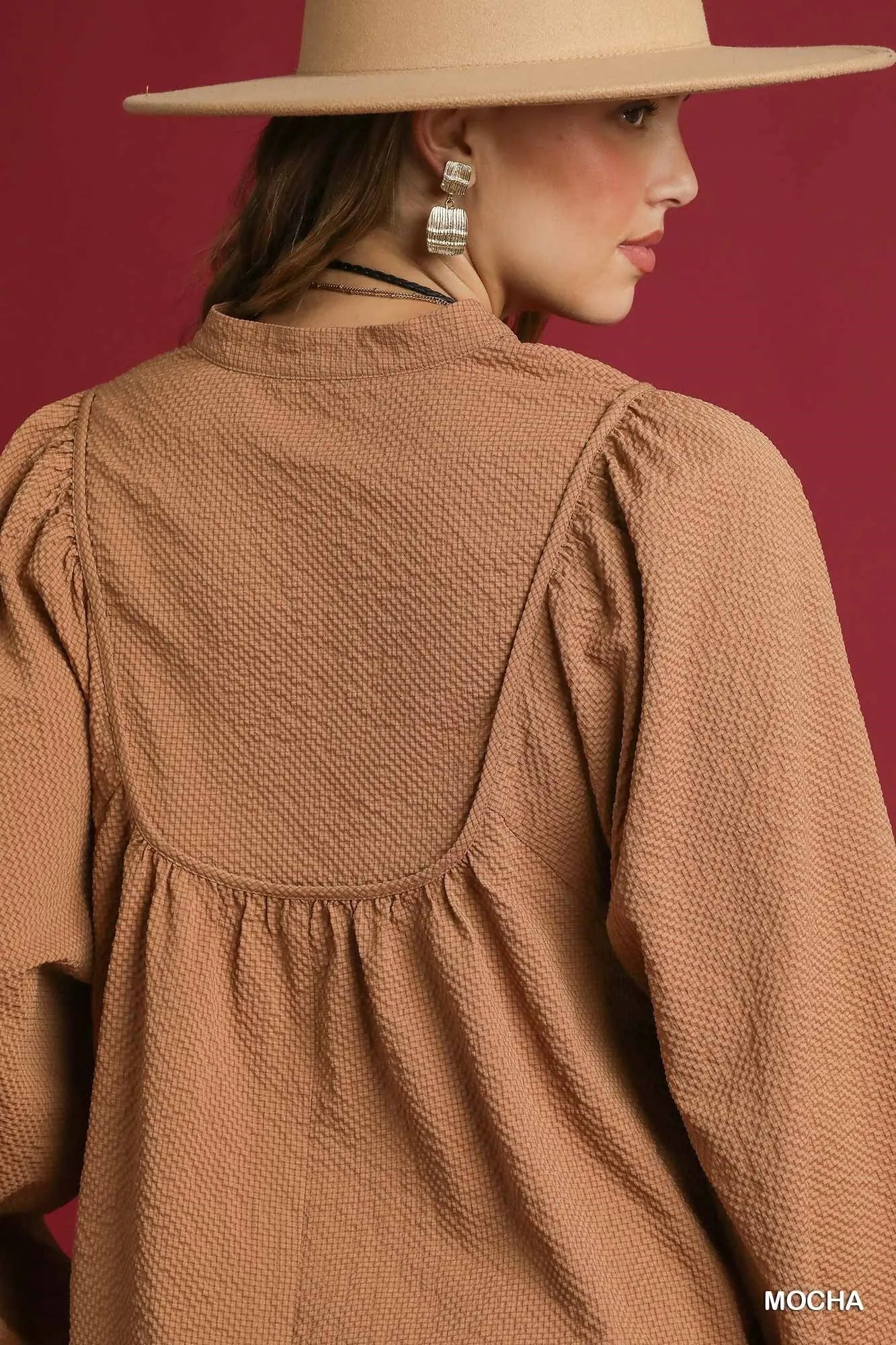 Mocha textured Umgee notched blouse with balloon sleeves, stylish and comfortable for casual or dressy wear.