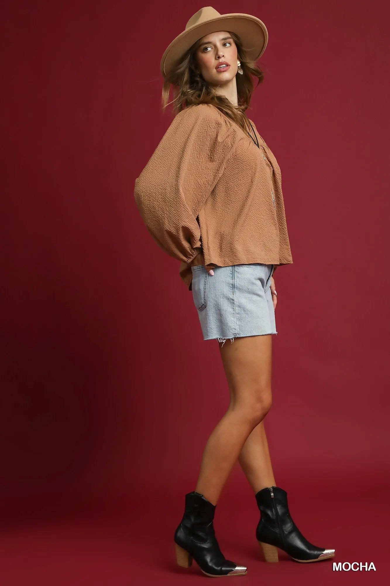 Trendsi Mocha Umgee textured notched blouse with balloon sleeves, showcasing a stylish and comfortable women's top.
