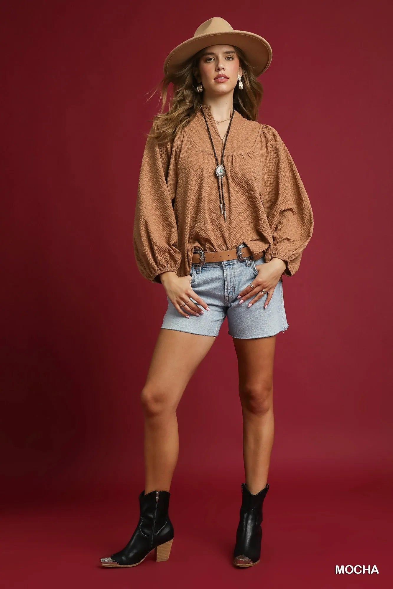 Mocha Umgee textured notched blouse with balloon sleeves, featuring a stylish design and soft fabric, perfect for casual or dressy looks.