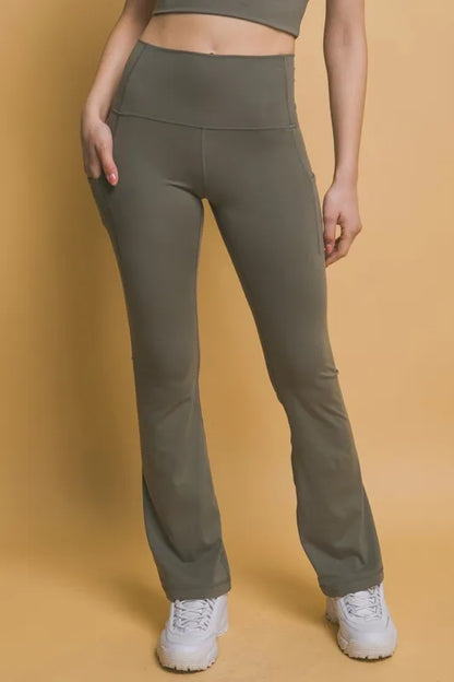 Trendsi Love Tree high waist flare active leggings with side pockets in moss green, stretchy athletic wear for women.