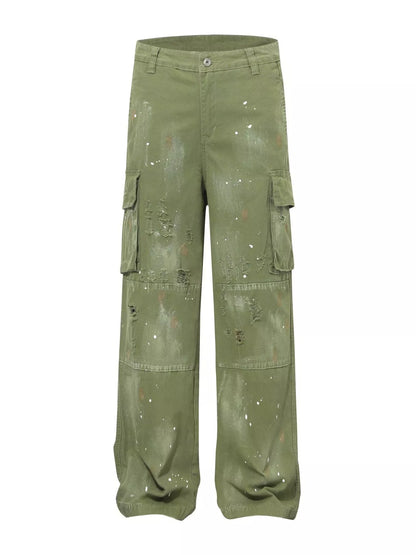 Men's distressed cargo pants with paint splatter from Trendsi, featuring multiple pockets and a rugged, stylish design.