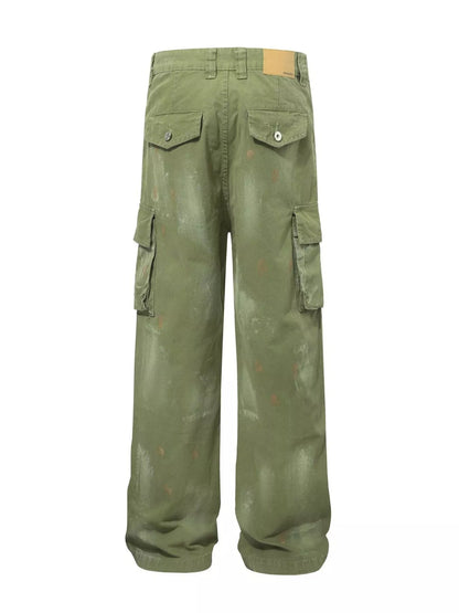Men's distressed cargo pants with paint splatter from Trendsi, featuring rugged design and multiple pockets.