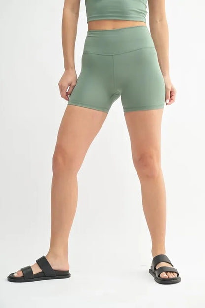 Trendsi MONO B Venice Cloud Light Contour Biker Shorts in moss green, stretchy fabric with a fitted, comfortable design.