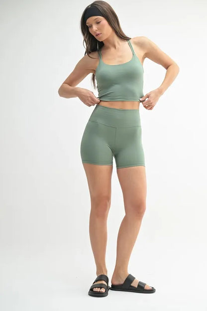 Mono B Venice Cloud light crisscross sports bra in moss green with stylish back design and supportive fit.
