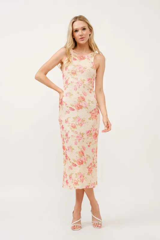 Multi-colored floral fishnet bodycon midi dress by Trendsi, featuring a fitted silhouette and intricate floral pattern.