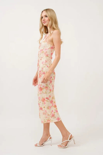 And The Why floral fishnet bodycon midi dress by Trendsi, featuring a vibrant floral pattern and fitted silhouette.