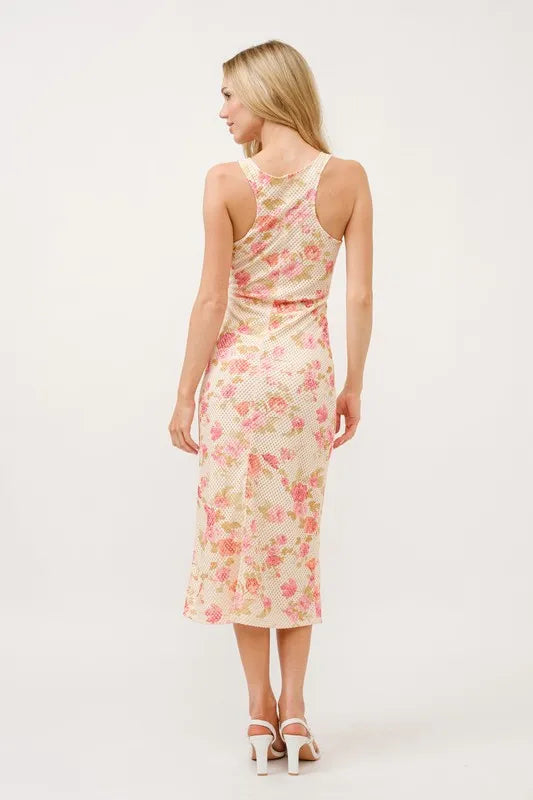 Multi-colored floral fishnet bodycon midi dress by Trendsi featuring a fitted silhouette and stylish design.