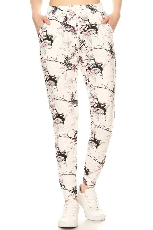 Plus size printed joggers by Trendsi, buttery soft leggings with drawstring, full size range, comfortable and stylish for casual wear.