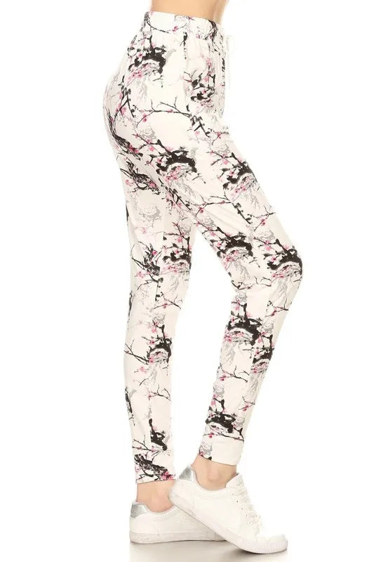 Plus size buttery soft printed joggers with drawstring from Trendsi, featuring a comfortable fit and stylish design.