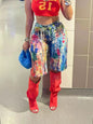 Multicolor artistic splash print shorts by Trendsi featuring vibrant, abstract patterns and a relaxed fit for casual wear.