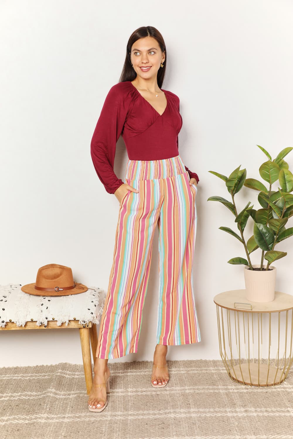 Multicolor striped smocked waist pants with pockets by Trendsi, featuring a relaxed fit and comfortable design.