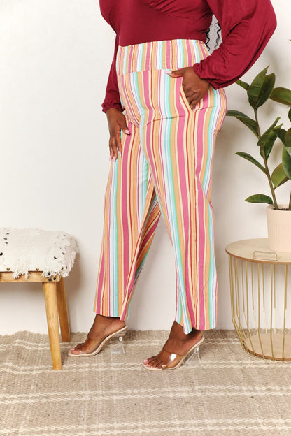 Multicolor striped smocked waist pants with pockets by Trendsi, featuring a stylish and comfortable relaxed fit.