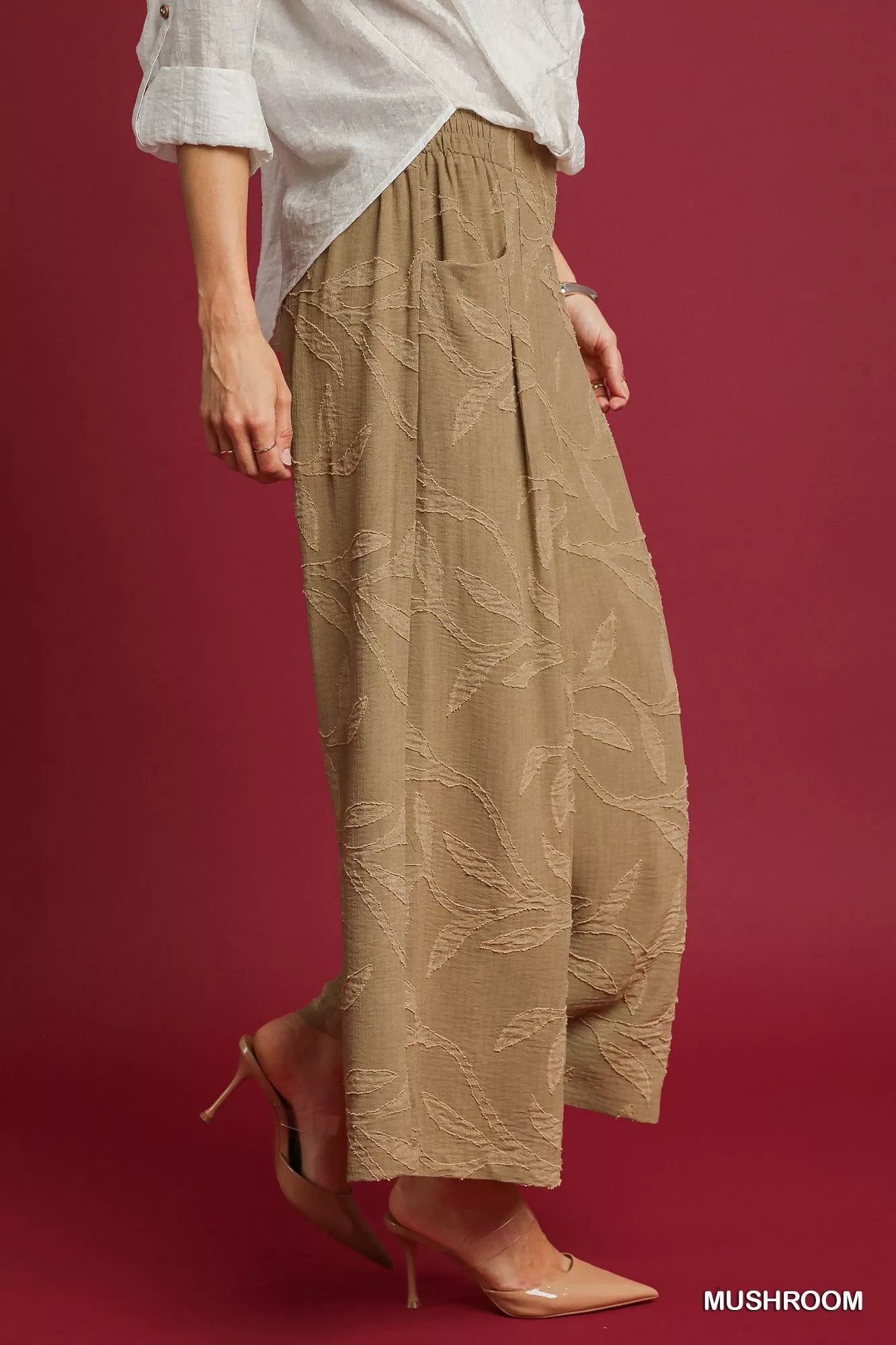 Umgee jacquard wide-leg pants in mushroom color with a relaxed fit and intricate woven pattern, displayed on a model.