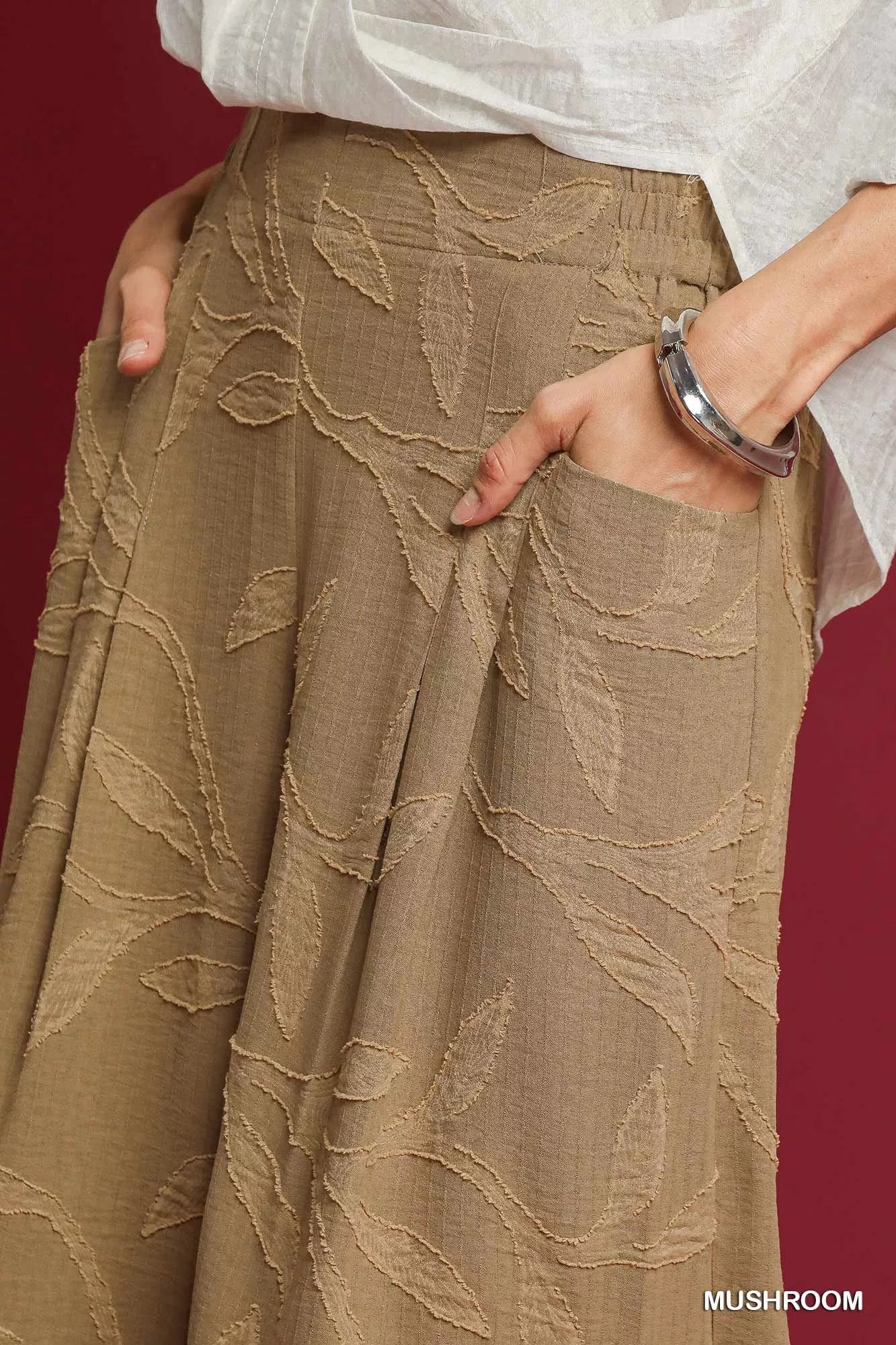 Umgee Jacquard Wide-Leg Pants in mushroom color featuring a textured pattern and relaxed fit, designed for comfortable style.