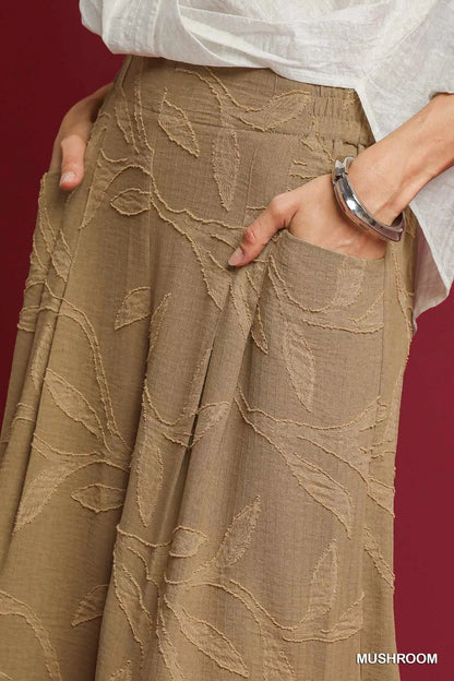 Umgee Jacquard Wide-Leg Pants in mushroom color featuring a textured pattern and relaxed fit, designed for comfortable style.
