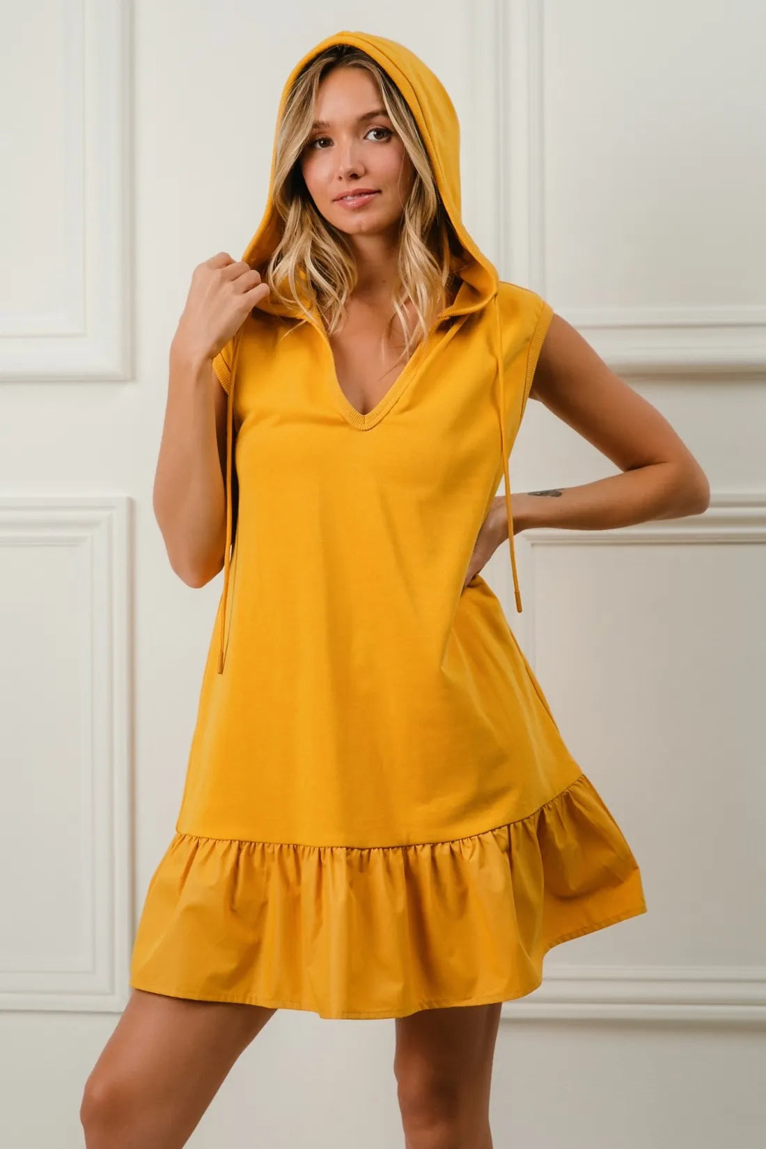 Mustard BiBi Ruffled French Terry Hooded Dress by Trendsi, featuring ruffled details and a comfortable hooded design.