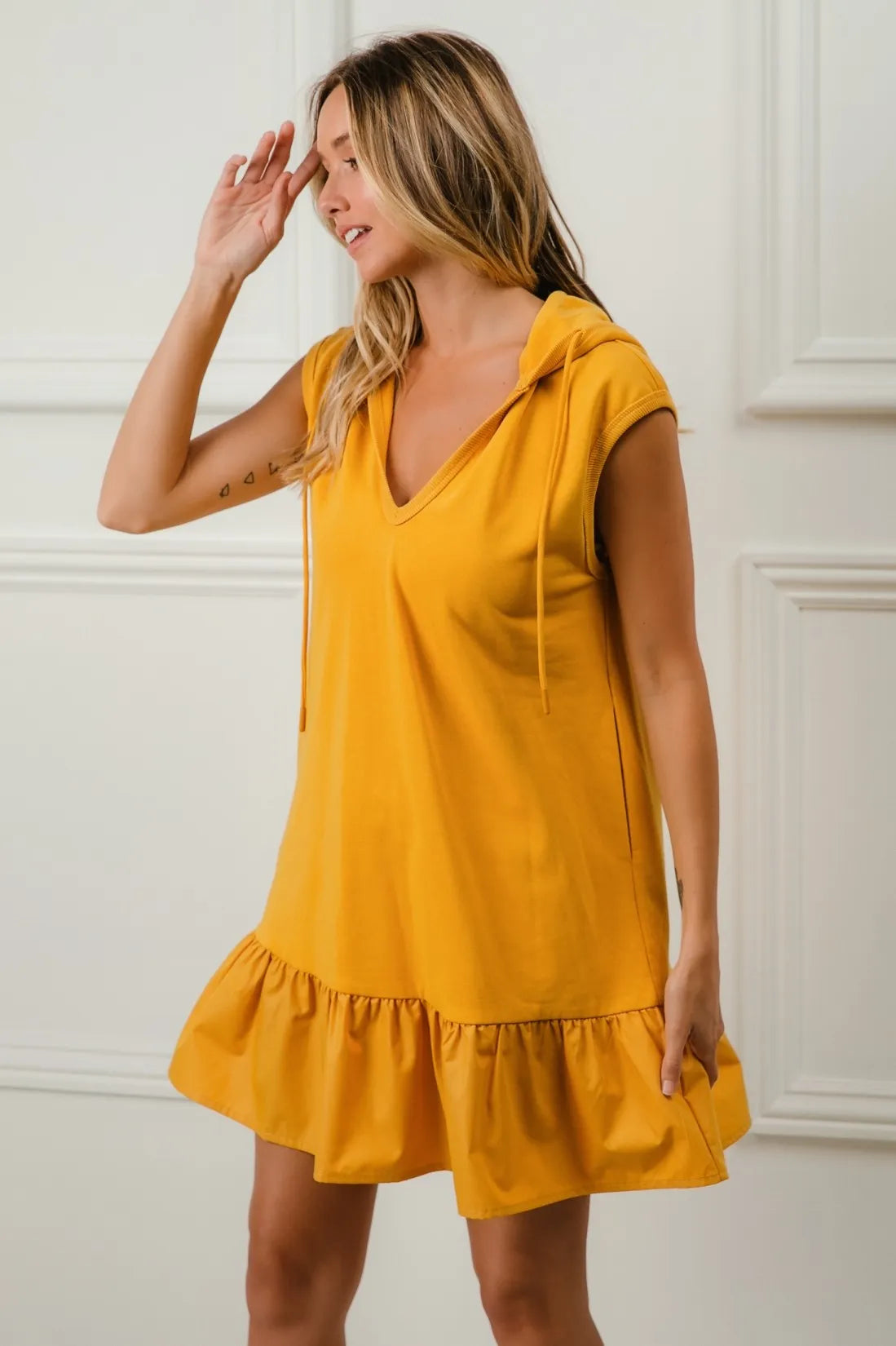 Mustard BiBi Ruffled French Terry Hooded Dress by Trendsi, featuring ruffle details and a cozy hood for a stylish, casual look.