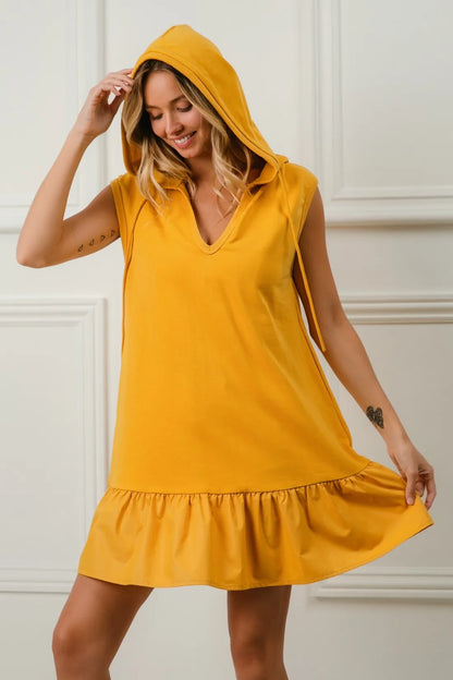 Mustard BiBi Ruffled French Terry Hooded Dress from Trendsi, featuring ruffle details, hood, and soft French terry fabric.