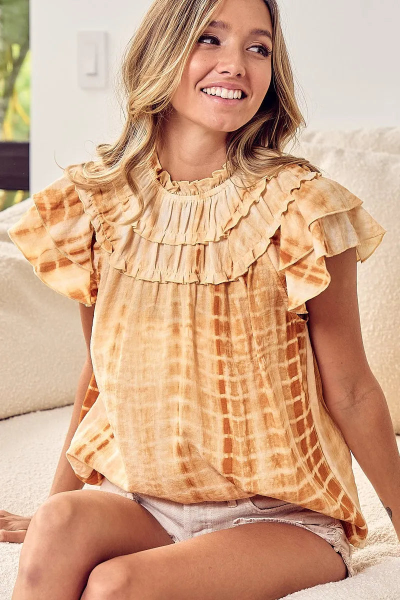 Mustard tie-dye BiBi tiered ruffle neck top by Trendsi, showcasing layered ruffles and vibrant tie-dye pattern.