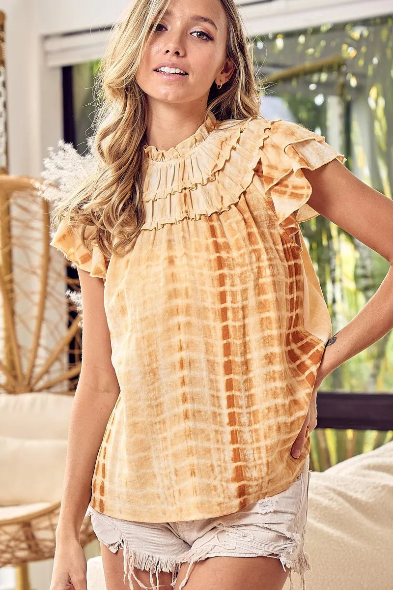 Mustard tie-dye BiBi tiered ruffle neck top by Trendsi, featuring a stylish layered design and ruffle details.