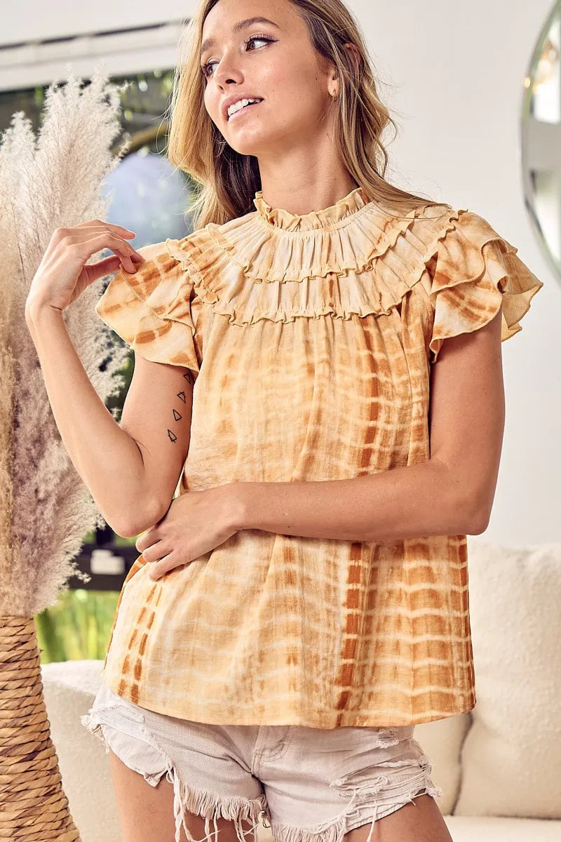 Mustard tie-dye BiBi tiered ruffle neck top by Trendsi, featuring layered ruffles and a stylish boho-inspired design.