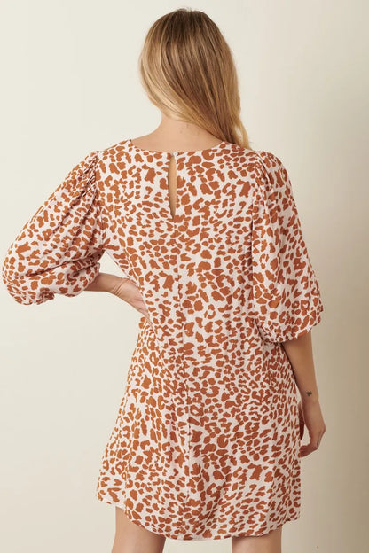 Mustard animal print puff sleeve mini dress by Mittoshop on Trendsi, featuring a fitted silhouette and stylish puff sleeves.