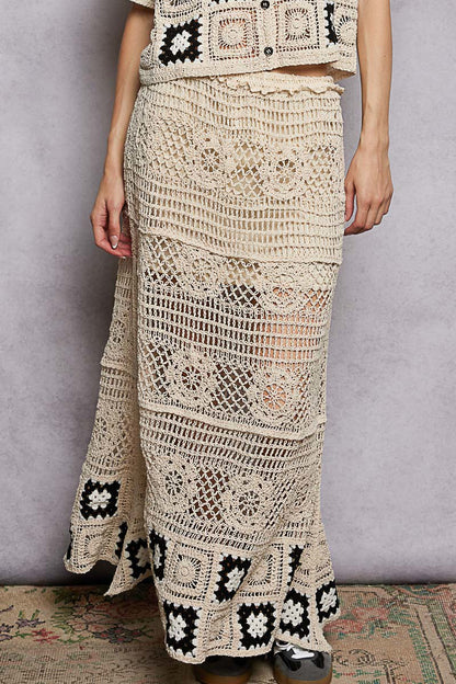 Natural black floral crochet maxi skirt with ruffled waistband and granny square weave, by Trendsi.