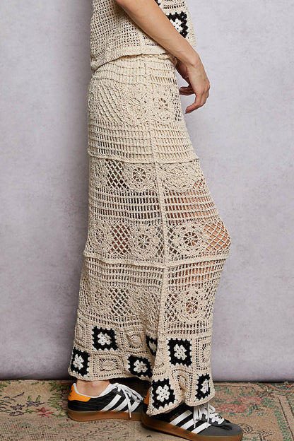 Natural black floral crochet maxi skirt with ruffled waistband and granny square weave by Trendsi, featuring a flowy, bohemian style.